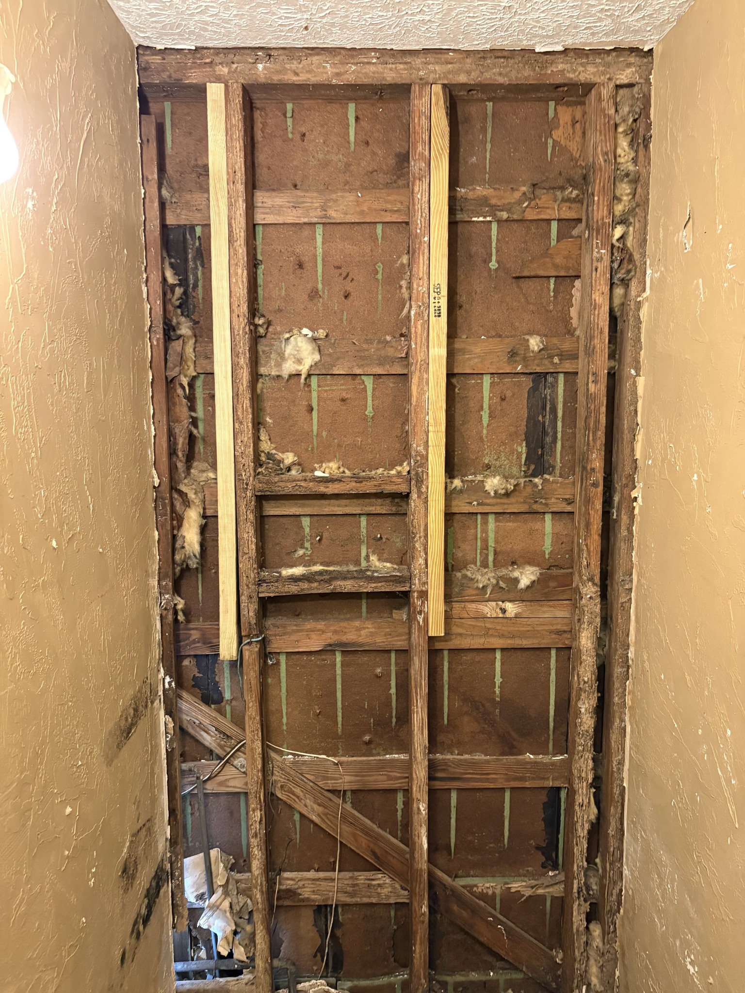 Wall opened to the framing